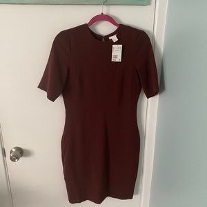 Mini dress with back slit.
